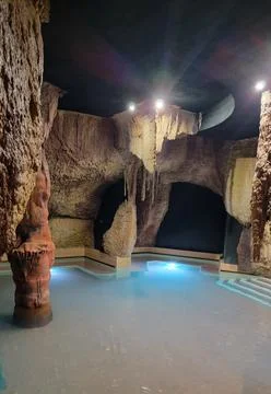 Underground cave, stone pool inside Stock Photos