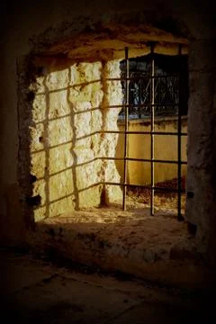 The underground cellar with bars in the sunlight Stock Photos