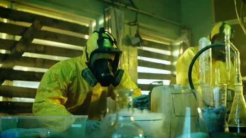 In the Underground Drug Laboratory Two Clandestine Chemists Make Drugs. Stock Footage 80217008