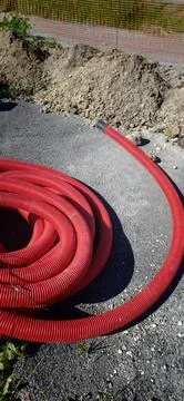 Underground electrical cable installation process in a construction area Stock Photos