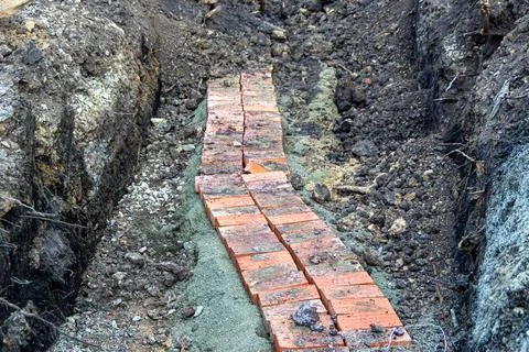 An underground electrical cable was opened to eliminate a cable break and again Stock Photos