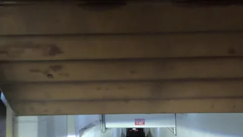 Underground Garage Corridor and Parking Area in Residential Building Stock Footage 338195091