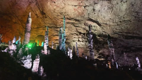 Underground limestone cave with tall stalagmites Stockbeeldmateriaal 340820227