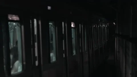 Underground metro train leaving station in subway tunnel in modern urban rail ma Stock Footage 219275202