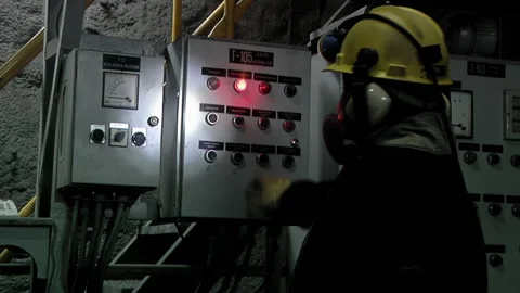 Underground Miner Operating Industrial Control Panel, Iron Ore Mine 動画素材 152543729