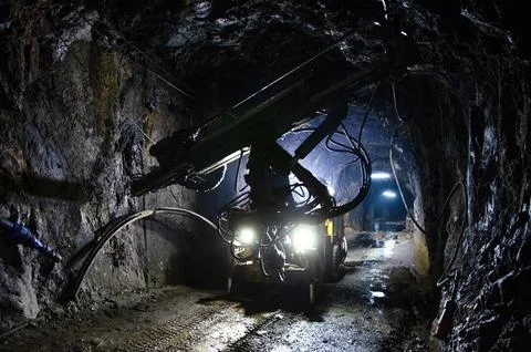 Underground mining operation at night Stock Photos