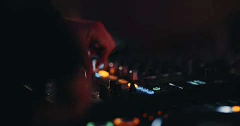 Underground Party DJ: Twisting knobs, pressing buttons and elements on his Stock Footage 263091875