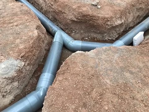 Underground pipe network system installing in trench Fotos Stock