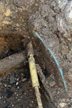 Underground pipe work undergoing repair. Stock Photos