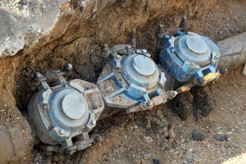 Underground pipe work undergoing repair. Stock Photos
