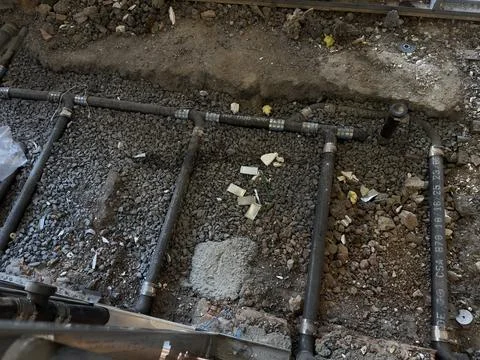 Underground Plumbing Rough-In Installation During Building Renovation Stock Photos