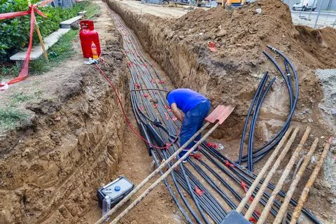 Underground power cables installation during reconstruction Stock Photos