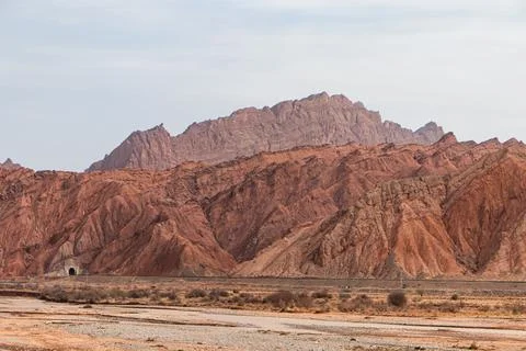 Underground red rocks exposed to the surface due to tectonic movements Stock Photos