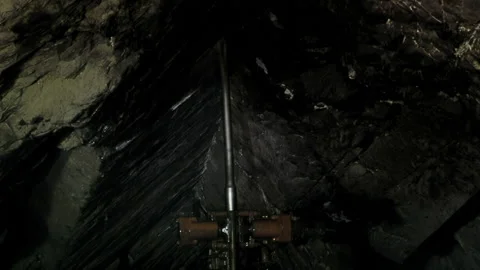 Underground Rotary Drill Rig Operating on Coal Tunnel Roof, Rio Turbio Coal Mine Stock Footage 152543601