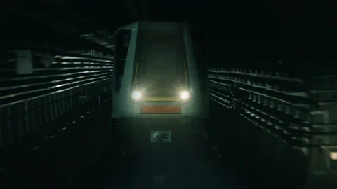 Underground subway train coming towards backward flying camera in a tunnel Stock-Footage 99063879