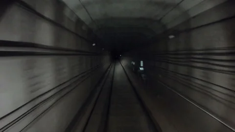 Underground train riding in darkness tunnel. Subway train moving at dark tunnel Stock Footage 306835305
