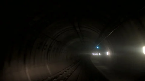 Underground Train runs through a dark metro tunnel. London, UK Video stock 45514389