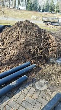 Underground utility pipes installation at construction site, Stock Photos