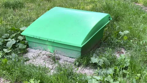 Underground Waste Container Lid in Green Urban Park Area | Long Shot Stock-Footage 337273318
