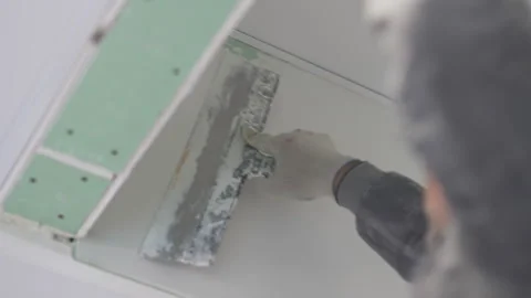 Underlayer gradually disappears under smooth plaster layer Stock Footage 316092622