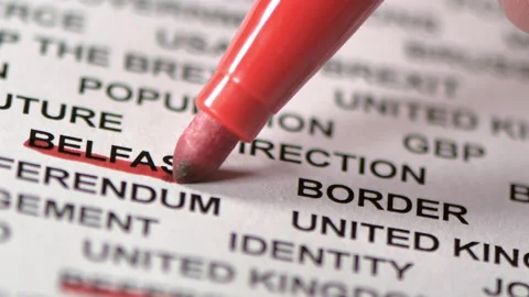 Underlining the Belfast and Border words on the paper Stock Footage 144697280