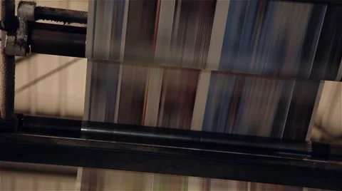 Underneath newspaper being printed in a printing press, close up Stock Footage 57323183