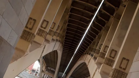 Underneath perspective of modern city bridge with stone and steel structure Vídeos de archivo 318087461