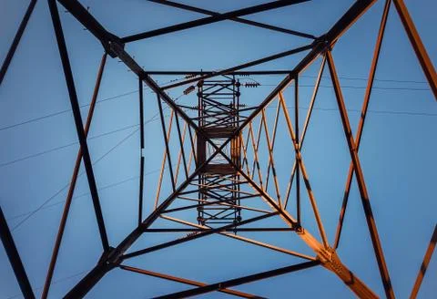 Underneath a truss pillar construction. Different geometric shapes, patterns  Stock Photos