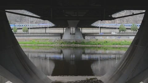 Underneath under bottom of city bridge Stock Footage 131471884
