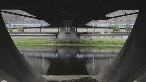 Underneath under bottom of city bridge construction Stock Footage 131471889