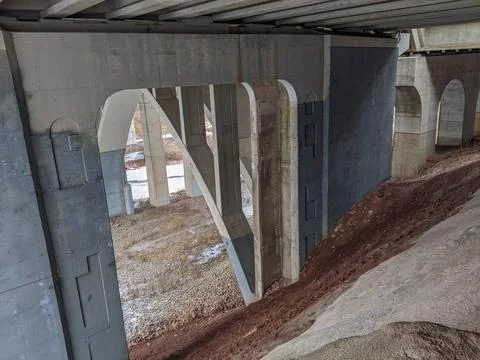 An Underpass of a Large Concrete Bridge Going Over a Valley Stock Photos