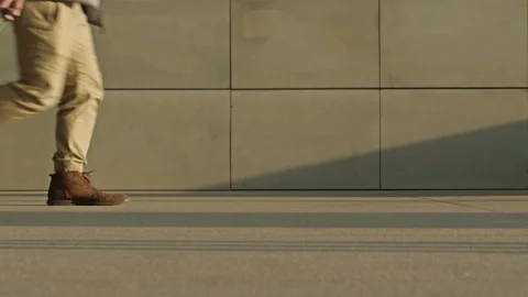 In an underpass or train station, a man in a hurry drops his red suitcase. Stock Footage 175918539