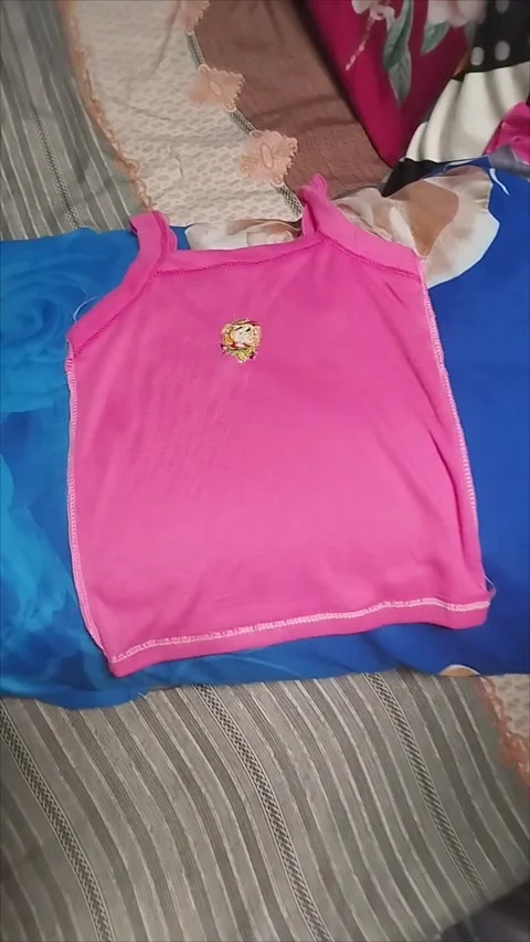 The undershirt for my son is pink Stock Footage 293056195