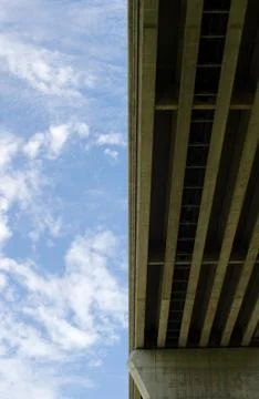 Underside of bridge on sky Stock Photos