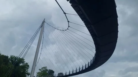 Underside of the Curving Sassnitz Bridge Against Cloudy Sky 스톡 동영상 346411605