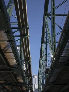 The underside of green steel elevated railway girders, Japan Stock Photos