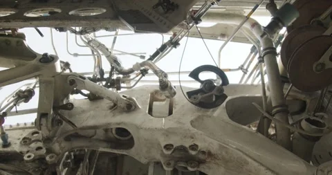 Underside of Large Industrial Machine with Pulleys, Heavy Machinery, Low Angle Stock Footage 340305546