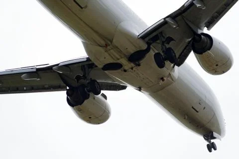 The underside of a modern airplane with its flaps Stock Photos