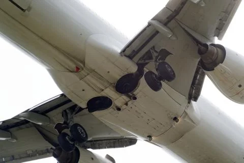 The underside of a modern airplane with its flaps Stock Photos