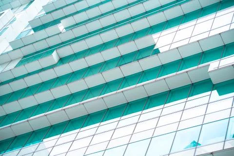 Underside panoramic and perspective view to steel blue glass high rise buildi Stock Photos