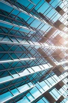 Underside panoramic and perspective view to steel blue glass high rise buildi Stock Photos