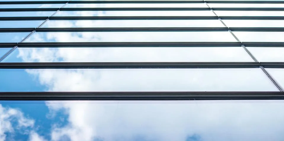 Underside panoramic and perspective view to steel blue glass high rise buildi Stock Photos