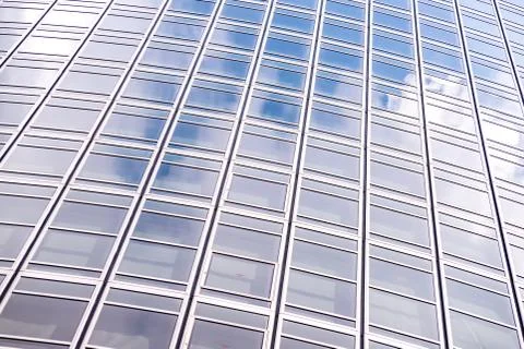 Underside panoramic and perspective view to steel blue glass high rise buildi Stock Photos