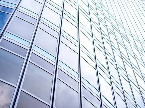 Underside panoramic and perspective view to steel blue glass high rise buildi Stock Photos