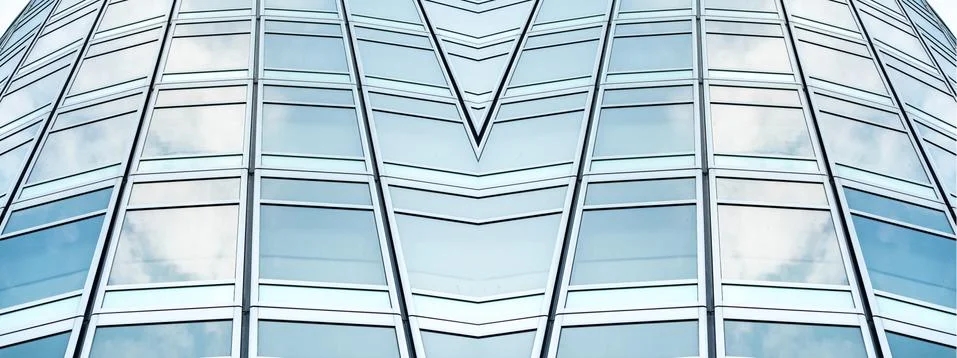 Underside panoramic and perspective view to steel blue glass high rise buildi Stock Photos