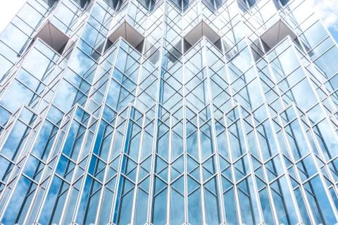 Underside panoramic and perspective view to steel blue glass high rise buildi Stock Photos