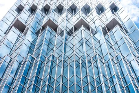 Underside panoramic and perspective view to steel blue glass high rise buildi Stock Photos