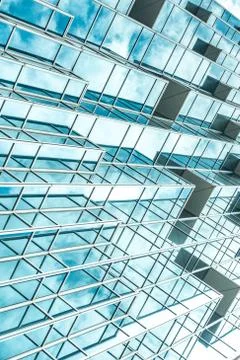 Underside panoramic and perspective view to steel blue glass high rise buildi Stock Photos