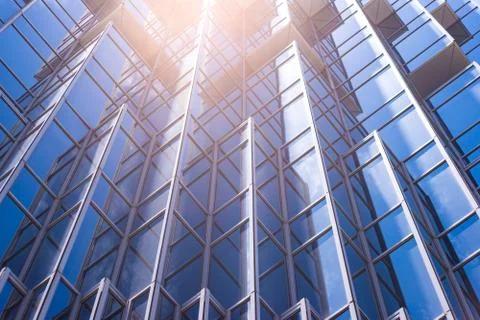 Underside panoramic and perspective view to steel blue glass high rise buildi Stock Photos