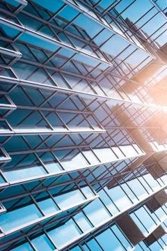 Underside panoramic and perspective view to steel blue glass high rise buildi Stock Photos